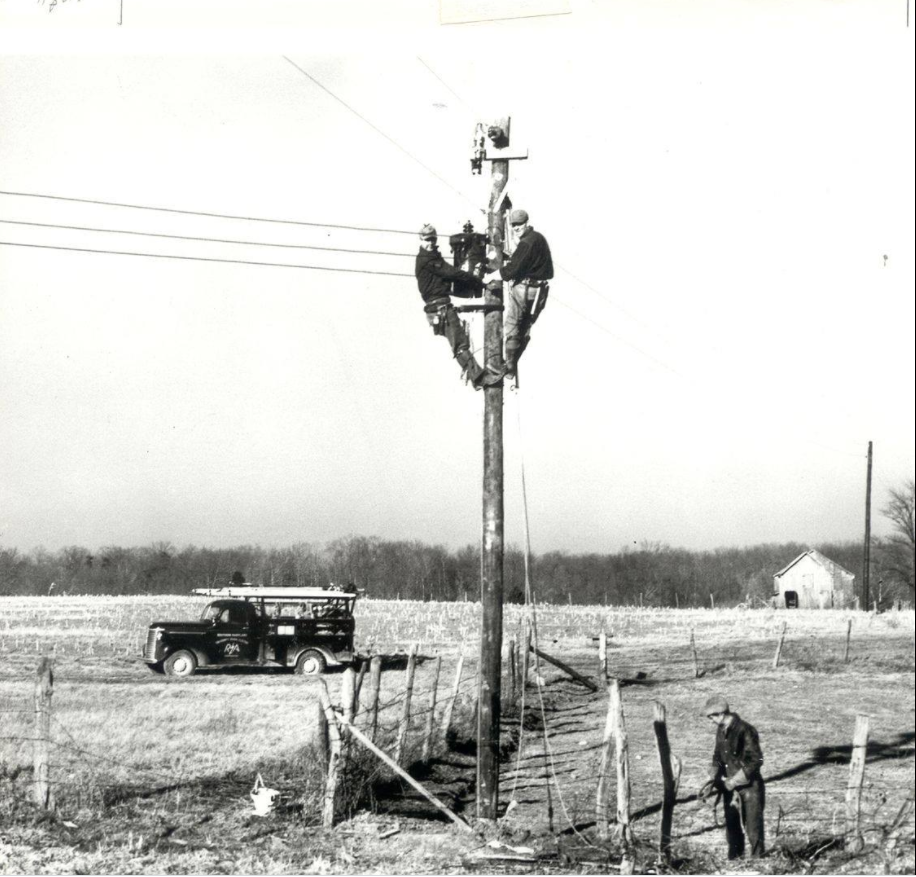 Old crew photo of pole climbing